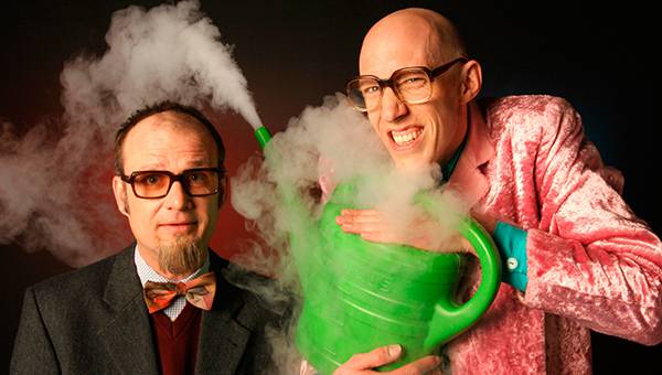Two physicists are making an experiment with a watering can and smoke