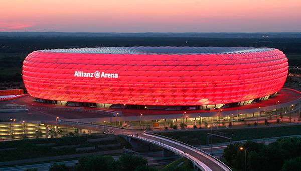 Allianz Arena highlighted in red at nighttime