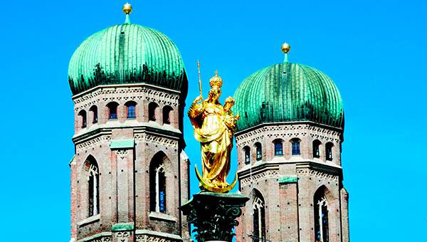 Towers of Liebfrauen church in Munich in front of blue sky