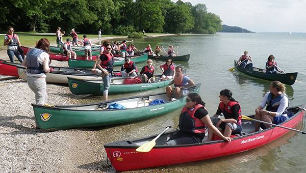 Canoes landing on the bank of Lake Starnberg